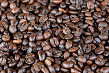Roasted coffee beans, black coffee background
