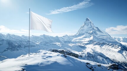 Snowy mountain peak with white flag under clear blue sky. Peace and tranquility concept