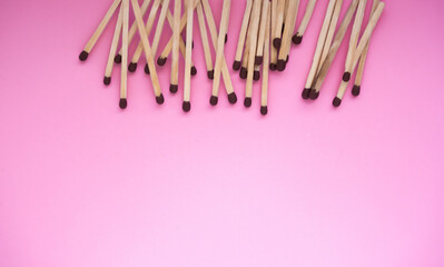 The matches lie in the upper part of the frame on a pink background. There is a space for the text.