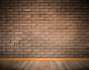 Brickwork and wooden floor with skirting board.