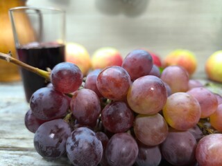 Red ripe juicy grapes on the table.