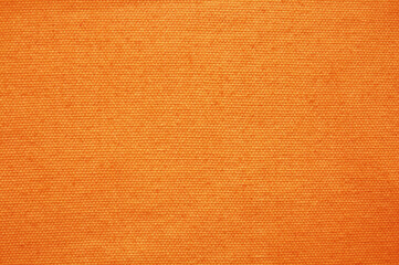 Orange fabric cloth texture for background, natural textile pattern.