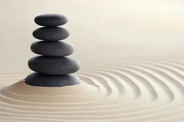 A minimalist design with stacked zen stones on a clean sand background, symbolizing the connection between mind, body, and nature.
