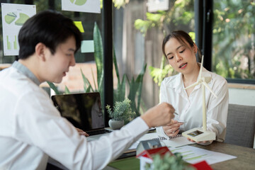 Innovative Solutions and Eco-design. Team brainstorming innovative solutions for sustainable architecture.