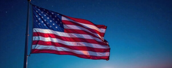 American flag waving in wind with stars shining at night, USA, night sky