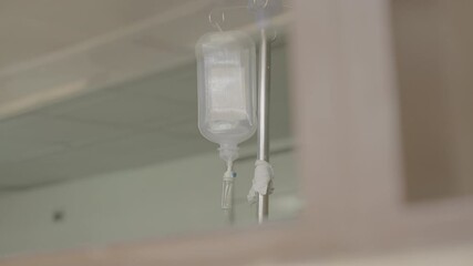 Medium shot of a transparent medical infuse in a hospital in Africa with medicine inside of it LOG - Powered by Adobe