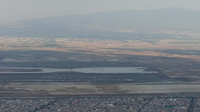 Aerial flight over northern Mexico City and State of Mexico, showcasing NAIM Texcoco