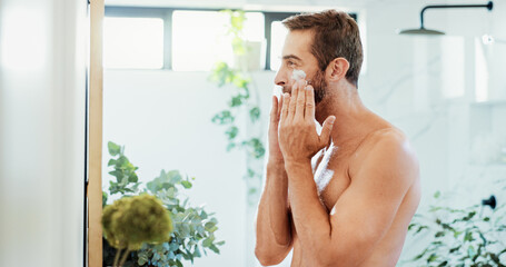 Man, skincare and lotion with moisturizer for grooming, facial treatment or skin protection at...