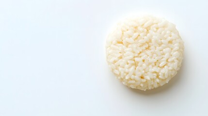 Close up of a round rice ball on white surface
