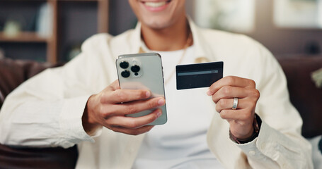 Credit card, phone and hands of man for online shopping, internet banking and payment in home....