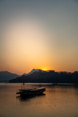 Naklejka premium Sunset over Mekong River, Laos. Peaceful evening, natural landscape