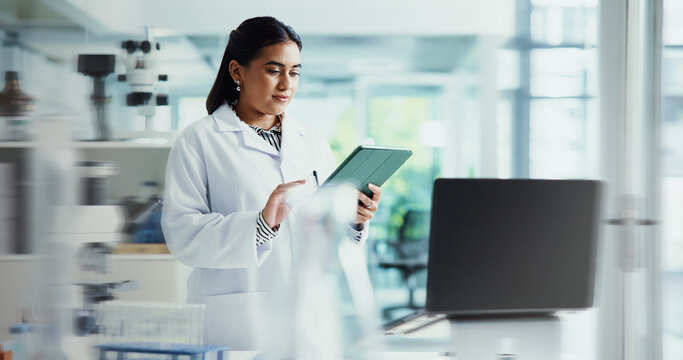 Tablet, woman and scientist in laboratory for research on healthcare innovation with biomedical engineering. Science, blur and female chemist working on technology for medical pharmaceuticals