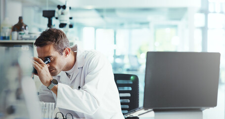 Fototapeta premium Research, biotech or man in lab with microscope, vaccine test or medical experiment for cancer treatment. Cure, check or scientist with science report, study or sample with dna, bacteria and laptop