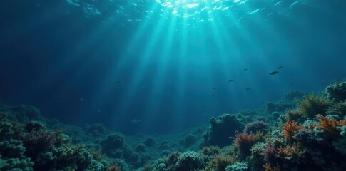 Fototapeta premium Dark blue ocean surface with scattered seaweed and small fish swimming in the distance, underwater, seaweed