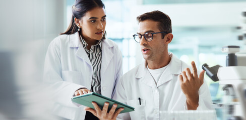 Talking, science or people in lab with tablet, microscope or medical experiment for cancer...