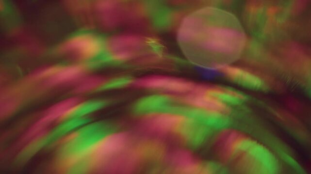 Bokeh dispersion lens. Overflows rays. Optical distortion. Colorful festive shimmer swirling dot kaleidoscope effect dust. Rounded lens variance light leaks.