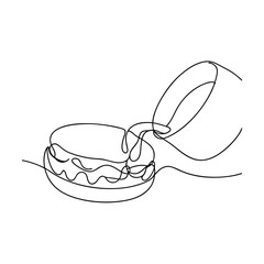 Single line drawing of pouring milk onto macaron dessert