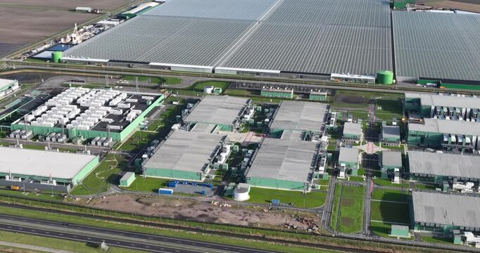 Aerial footage of the Agriport a7 on a sunny day in Middenmeer village, North Holland, Netherlands