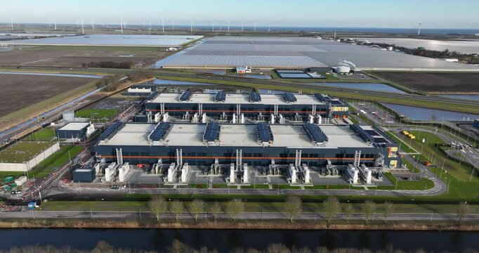 Aerial footage of the Agriport a7 on a sunny day in Middenmeer village, North Holland, Netherlands
