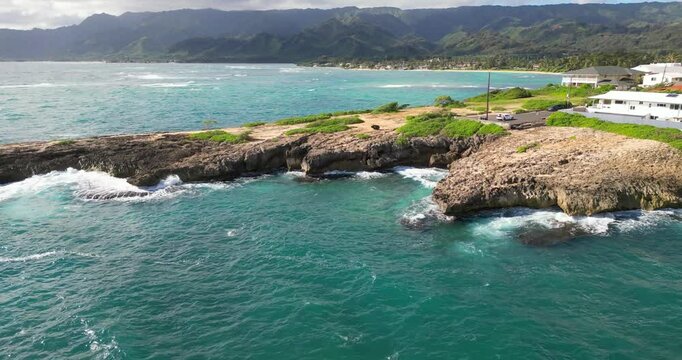 Drone footage of the scenic Laie Point State Wayside on a clear sunny day in Laie town, Hawaii, USA