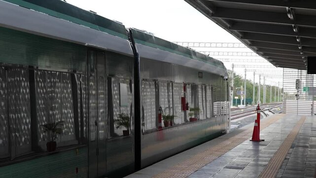 mayan train railoard cars leaving the station in valladolid yucatan mexico (new tourist travel destination metro system peninsula) reflection stop moving riding traveling departure