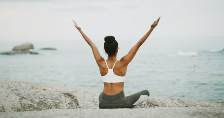 Ocean, freedom and meditation for woman, outdoor and spiritual practice for wellness, peace and relax. Sea, chakra and self awareness for person, back and yoga with mindfulness benefits or zen