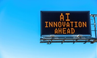 Digital road sign with glowing text about artificial intelligence progress on blue sky background. Futuristic concept of technology growth, automation, and machine learning future innovation