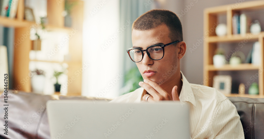Fototapete Glasses, student and man on sofa with laptop for online research, studying and elearning for college. Remote work, home and person on computer for project, assignment and thinking for university