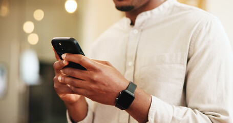 Man, hands or typing with phone for social media, chatting or check in at luxury hotel. Closeup, male person or customer with mobile smartphone or app for online post, network or connection at resort