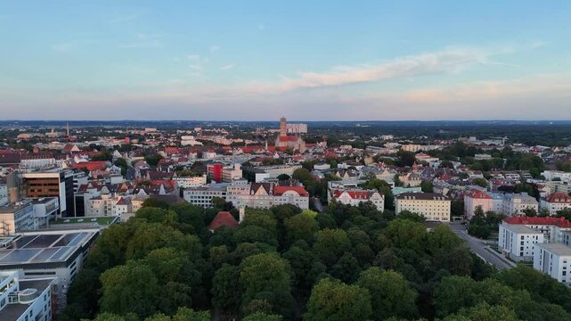 Panorama flight towards Augsburg city center with Basilica of SS. Ulrich and Afra, Germany
