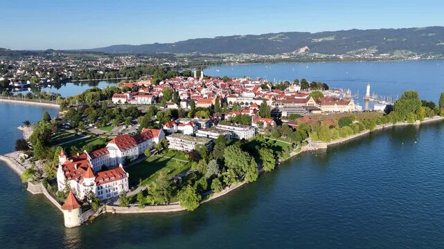 Panorama flight towards Lake Constance (Bodensee) island Lindau with old town in Germany