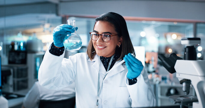 Liquid, woman and scientist with beaker in laboratory for pharmaceutical experiment, research or innovation. Chemical, glass and female medicinal chemist with formula, reaction observation or cure.