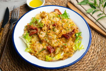 A Spanish tapa of Tortillas de camarones. Small portions of fried fritters with shrimp and vegetables.