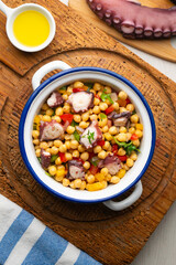 Octopus, chickpea, and vegetable salad. Traditional Spanish octopus salpicon tapa recipe.