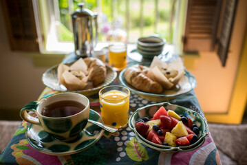 Cozy Breakfast with Fresh Pastries and Fruit