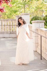 Fototapeta premium Radiant high school graduate shines in her elegant prom dress