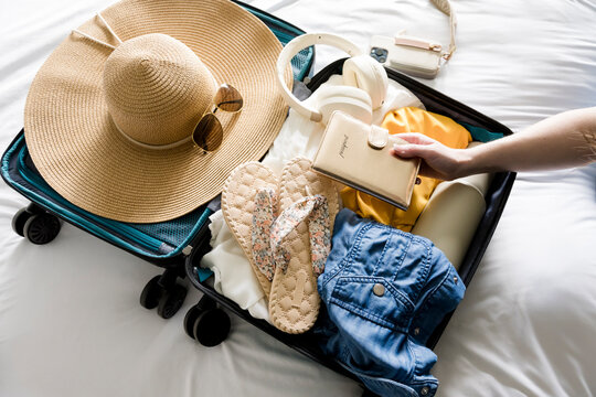 Woman packing for summer vacation