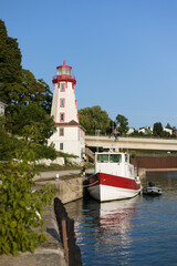 Boats moored on the dock by Kincardine lighthouse in Ontario