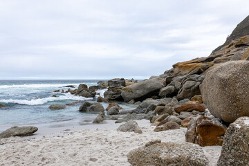 Ocean beach and mountain rocks waves