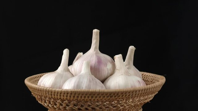 Fresh garlic on black background