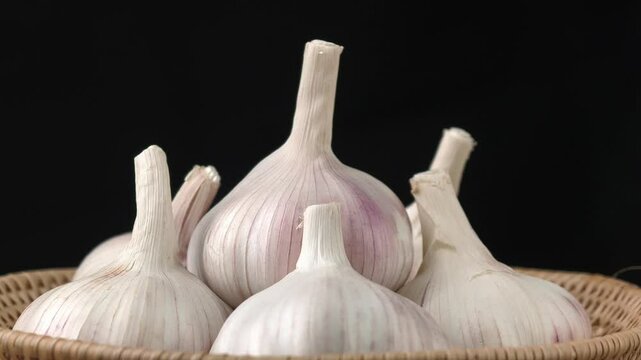 Fresh garlic on black background