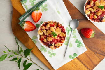 Homemade strawberry crumble in an individual mold, baked in the oven.