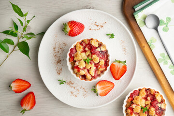 Homemade strawberry crumble in an individual mold, baked in the oven.