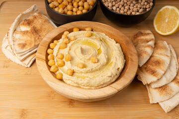 Hummus in bowl, houmous dip, chickpea humus tahini sauce, middle eastern spread