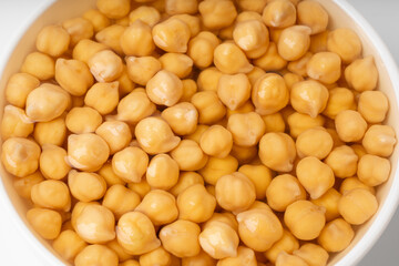 Soaked chickpeas, chick pea in water, swollen wet Cicer arietinum fruits, garbanzo beans cooking