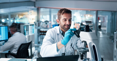 Fototapeta premium Science, microscope and smile with man in laboratory for DNA discovery, healthcare or research. Gene study, medical and clinical trial with scientist in clinic for forensic, results and biotech