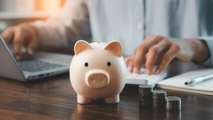 Concepts of saving money and financial planning. Men manually manage budgets to save expenses and savings. earnings, financial, loan, economic, finance, wealth, piggy bank, assurance, future.