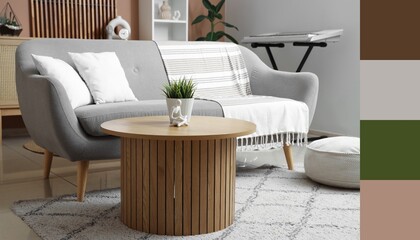 Fototapeta premium Interior of modern living room with grey sofa and wooden table. Different color patterns