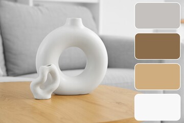 Stylish vases on wooden table in living room. Different color patterns