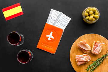 Travel to Spain. Passport and airplane tickets with traditional Spanish meal